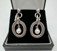 A pair of silver, 14ct gold and pearl drop earrings by Michael Dawkins. Round white single pearl