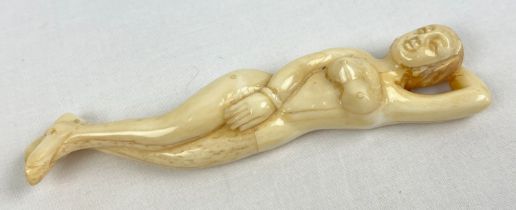 A carved nude figurine of an Oriental lady with polished finish, possibly bone. Approx. 13cm long.