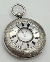 A small antique Argent 935 silver half hunter pocket watch with enamelled dial, roman numeral