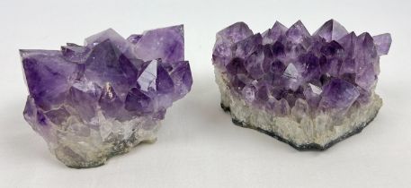 2 natural amethyst clusters with varying sized points to each. Largest approx. 10 x 14cm.