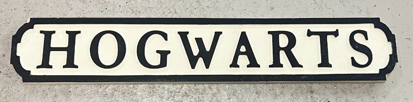 A modern painted wood Harry Potter 'Hogwarts' sign, in the style of an old street sign. Approx. 78cm
