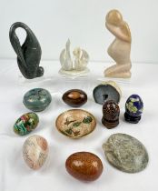 A collection of assorted natural stone, enamelled and wooden items to include carved soapstone