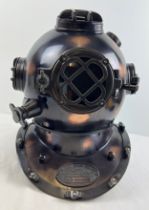 A full sized replica bronzed metal mark V US Navy divers helmet. With glass panels and hinged