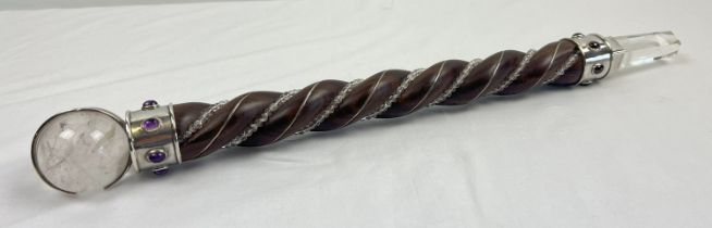 A large spiral carved wood and clear quartz healing wand with clear quartz sphere and point.
