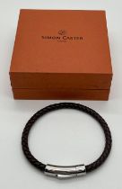 A new in box Simon Carter, London plaited brown leather bracelet with silver tone hardware and