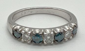 A 9ct white gold 7 stone blue and white diamond eternity ring by Kallati. Makers name and gold