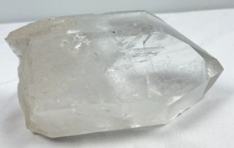 A 2.75kg natural clear quartz point with internal galaxies and rainbow inclusions. Approx. 9.5cm x