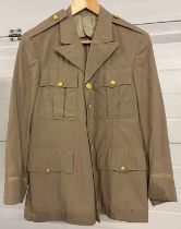 An American army dark beige jacket with bras buttons to front and pockets. Chest approx. 38 inches.