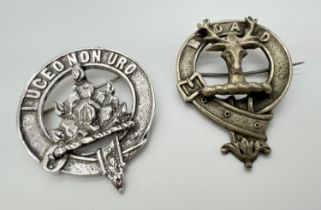 2 vintage white metal Scottish clan pin back badges. A circular belt design badge with stags head