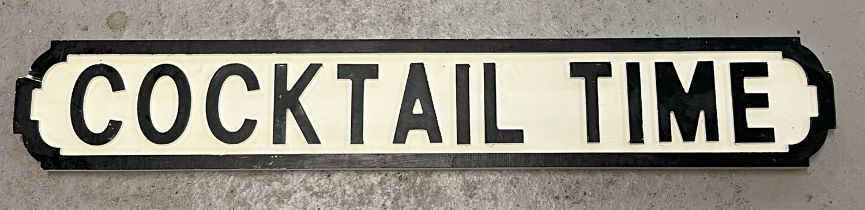 A modern painted wood 'Cocktail Time' sign, in the style of an old street sign. Approx. 84cm long.