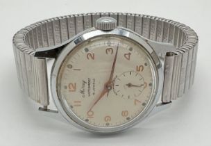 A men's vintage wristwatch by Miray with a Fixo Flex expanding strap and secondary dial. White