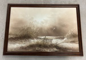 A large framed oil on canvas of costal sand dunes in sepia tones. Signed to bottom right. Frame size