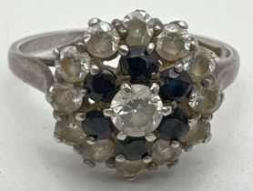 A vintage silver, sapphire and cubic zirconia cluster dress ring. Hallmarked and stamped CZ inside