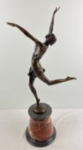 After Bruno Zach - an Art Deco style bronze figurine of a dancing girl, raised on a conical shaped