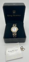 A boxed Krug-Baumen Regatta unisex watch. Two tone stainless steel case and strap. White face with
