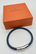 A boxed Simon Carter men's plaited blue leather bracelet with stainless steel hardware and push