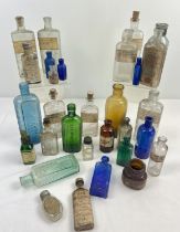 A quantity of vintage medicine and tincture bottles in various sizes and colours. To include