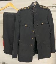 A vintage Royal Artillery officers dress jacket and trousers with red stripe. Brass buttons to front