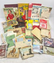 A box of assorted vintage ephemera to include pamphlets, postcards, cookery books and manuals,