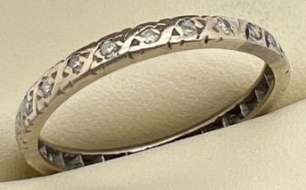 A vintage gold and diamond full eternity ring, unmarked but tests as 22ct gold. Ring size R. Looks