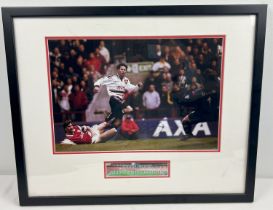 A framed and glazed signed photograph of Manchester United player Ryan Giggs. Complete with