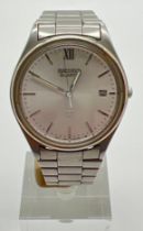 A vintage Seiko 5 quartz wristwatch with stainless steel case & strap and white face. Silver tone