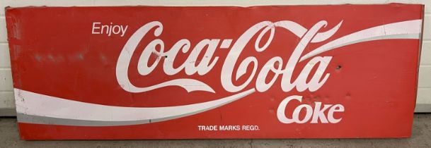 A large vintage painted tin advertising sign for Coca-Cola. Collection of small dents to front