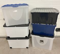 6 large plastic storage tubs with lids, to include 2 with wheels. Largest approx. 40cm deep.