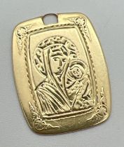 A 14ct gold square shaped Virgin Mary pendant with inscription to reverse. Floral design to all
