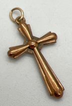 A vintage 9ct rose gold cross shaped pendant with hanging bale. Approx. 3cm x 1.75cm. Hallmarks to
