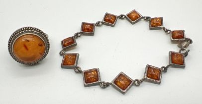 A silver amber set 7.5" bracelet with lobster claw clasp, together with a white metal dress ring set
