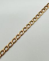 A 9ct gold 9" curb chain bracelet with spring ring clasp - clasp fixing ring missing. Gold marks