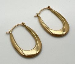 A pair of 9ct gold elongated hoop earrings. Gold marks to posts. Approx. 2cm long. Weight approx.