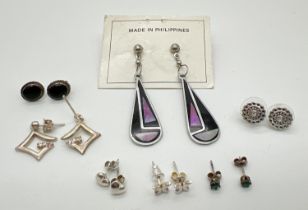 7 pairs of silver and white metal earrings in both stud and drop styles. To include bubble hearts,
