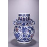 A Chinese blue and white and copper red 'Lotus scroll' Hu vase, Qianlong mark, H 42 cm