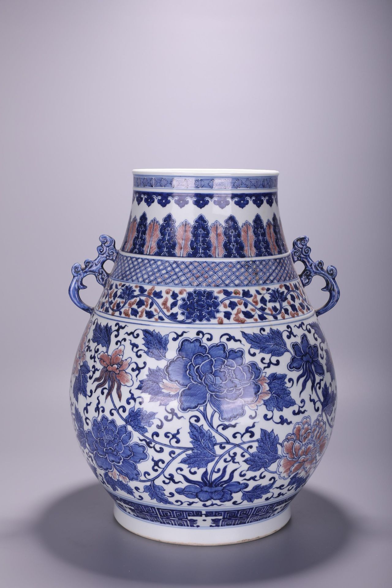 A Chinese blue and white and copper red 'Lotus scroll' Hu vase, Qianlong mark, H 42 cm
