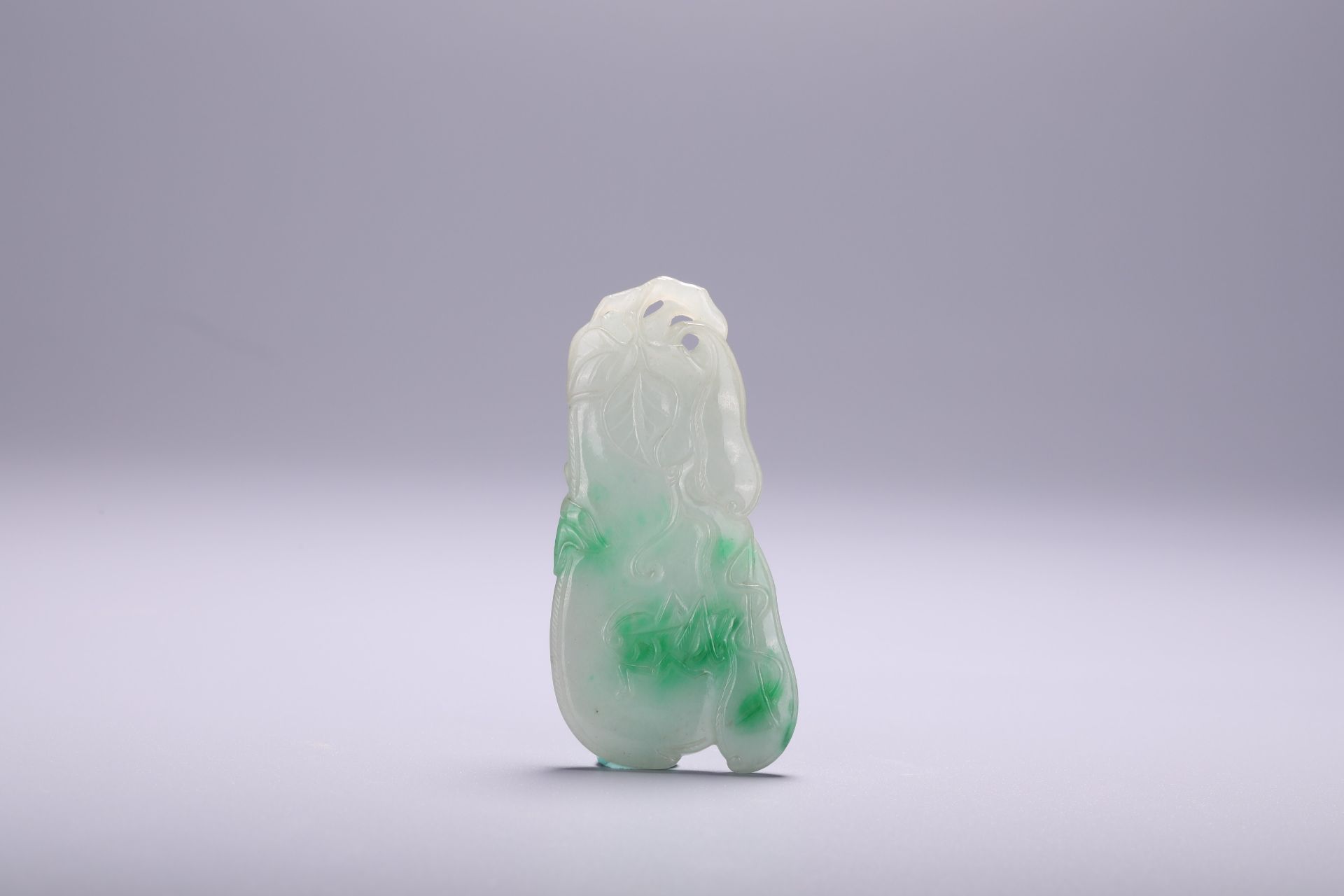 A Chinese jadeite feicui jade carved pendant, L 7 - W 3,5 cm