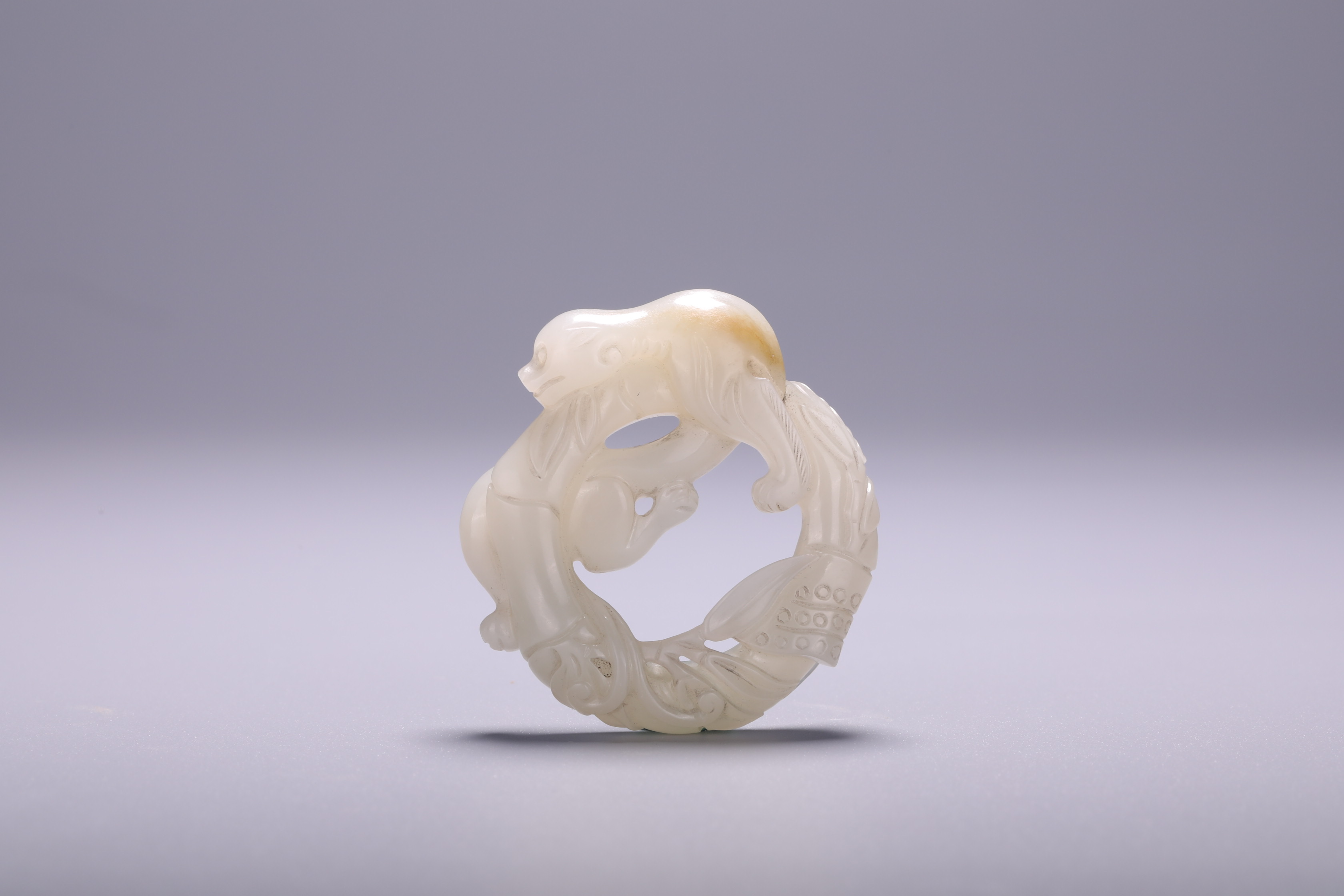 A Chinese jade 'Dragon' carving, Dia 5 cm