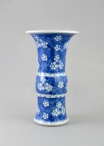 A Blue and White Beaker Vase with Prunus, Kangxi period, , painted in soft tones with prunus on a