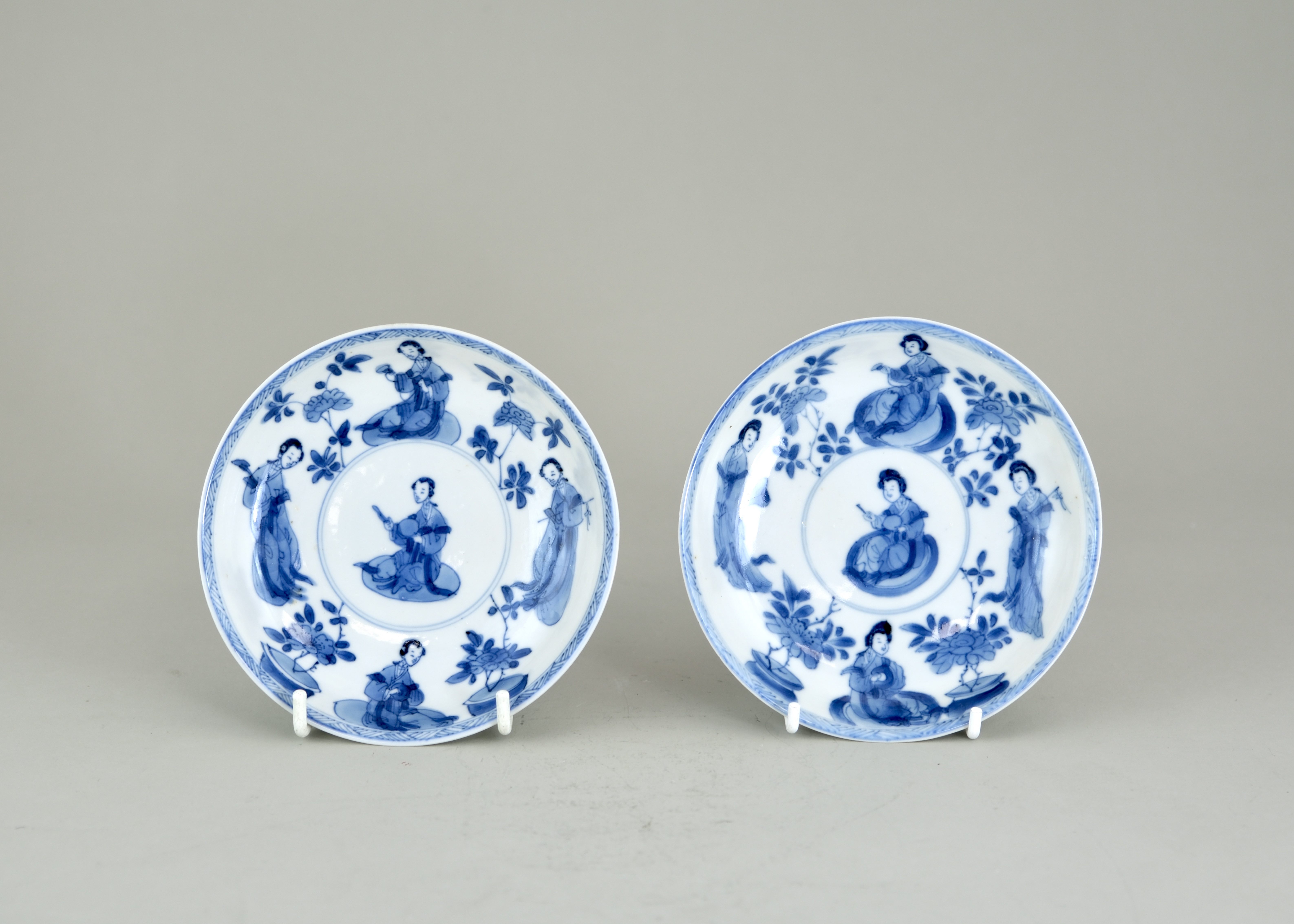 A Pair Blue and White 'Lange Lijsen' Saucers, Kangxi, , each well painted in soft greyish cobalt