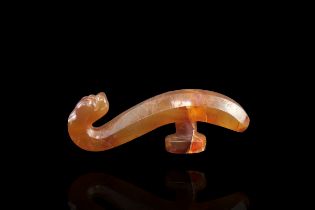 An Agate Belthook, Han dynasty, a brownish agate belthook with tiger head terminal the tiger