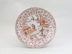An Iron Red decorated Dish with Figures, Kangxi,, the petal moulded barbed rim, pencilled with