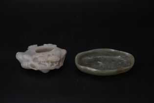 Two Jade Brushwashers, 19th/20th century, comprising a celadon jade hollow pine and a lobed sage