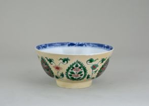 A 'famille verte' Persian Market Bowl, Kangxi, enamelled on the 'cafe au lait' exterior with saz