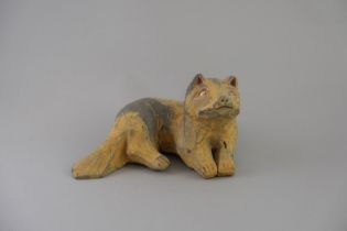 A Pottery Fox, Han dynasty, the recumbent beast with head looking up, body overall painted in