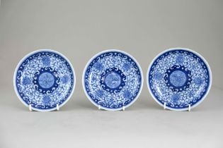 Three Blue and White dishes, 18th/19th century, each with pecilled flower scroll around a central