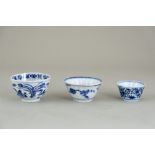 Three Blue and White Teacups, Kangxi, comprising two fluted cups, one with geese and the other