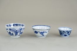 Three Blue and White Teacups, Kangxi, comprising two fluted cups, one with geese and the other