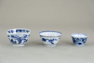 Three Blue and White Teacups, Kangxi, comprising two fluted cups, one with geese and the other