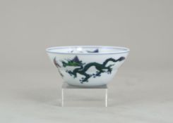 A Small Doucai Dragon Bowl, six character underglaze blue mark of Yongzheng, the ogival rounded